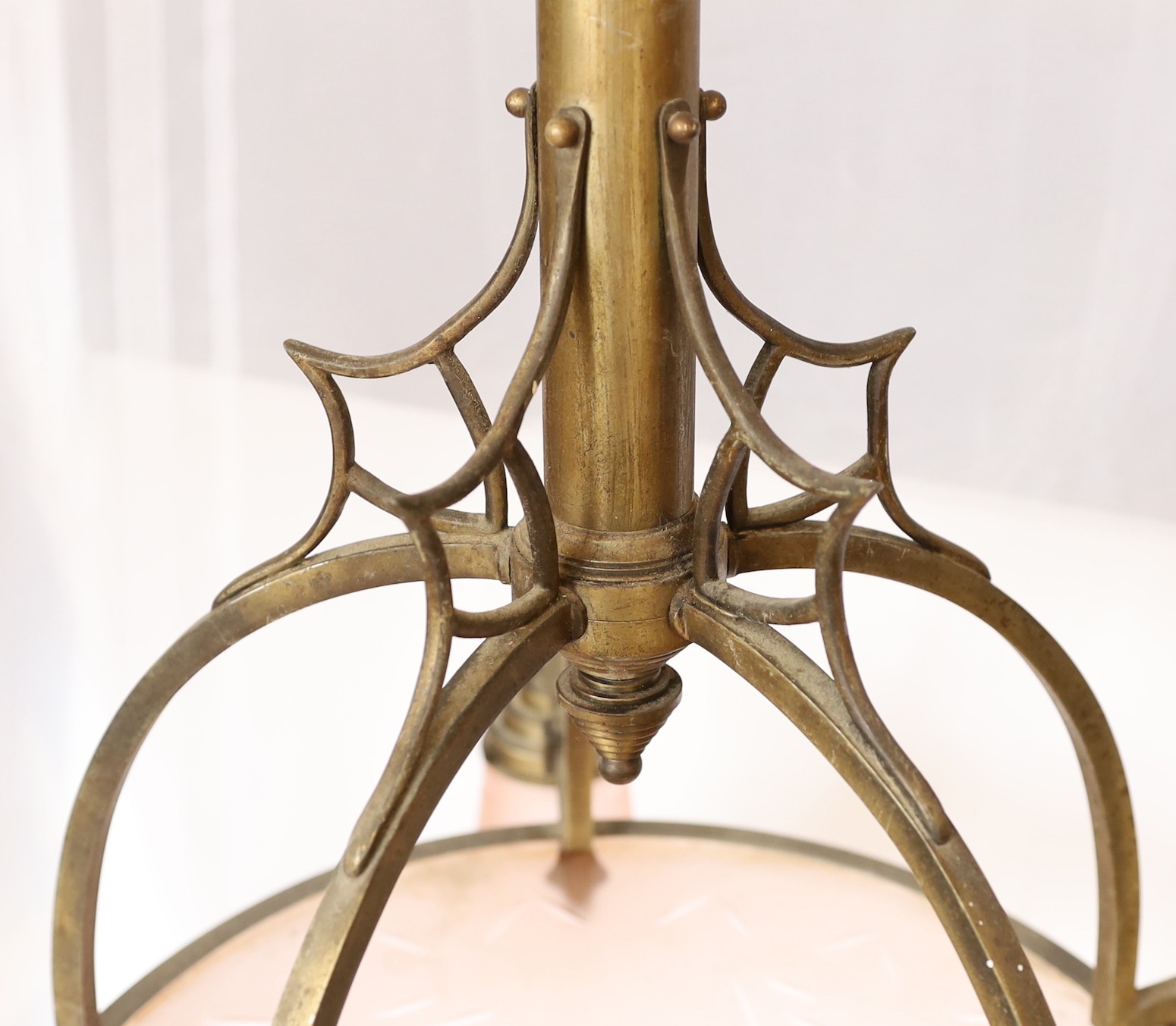 A 1920s-30s German bronze and frosted peach glass five light chandelier of stylish design with geometric cut decoration, drop 75cm. width 70cm